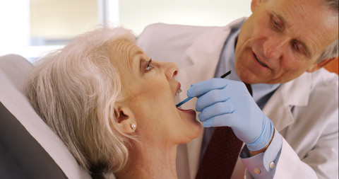 A lady getting dentures fitted