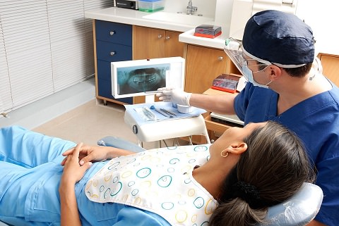 A lady at her dentist for a check up