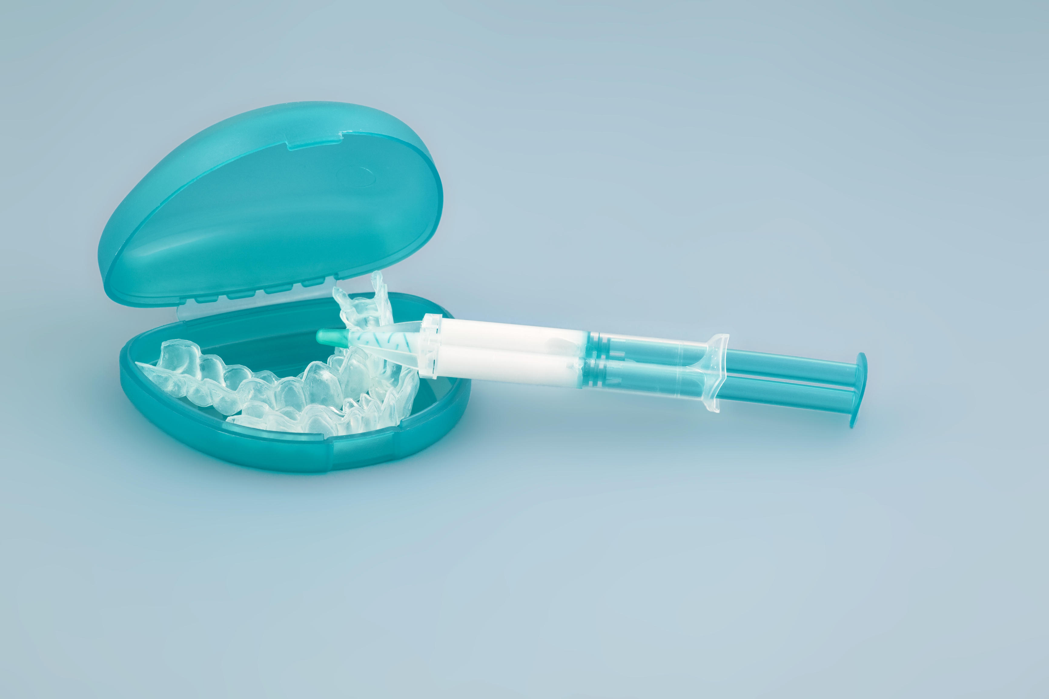 A photo of a teeth whitening mouth tray and product