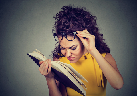 A woman reading a booking