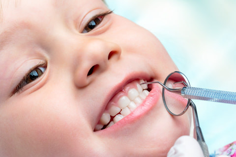 A child getting checked at the dentist