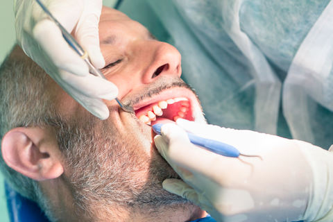 A man with bleeding after a tooth extraction