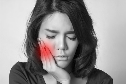 A lady experiencing a toothache