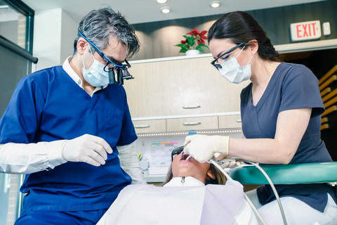 A dentist putting in a filling
