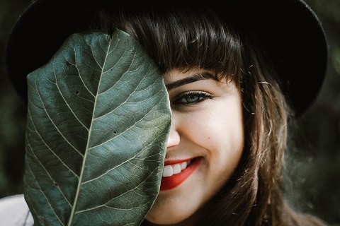 A woman slightly showing her smile