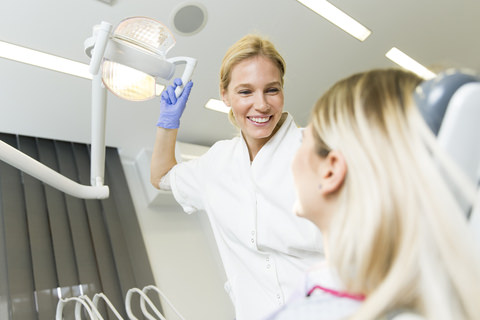 A dentist checking her patient