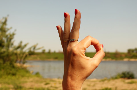 A lady giving the the A okay sign