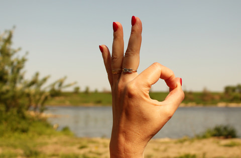 A lady giving the the A okay sign