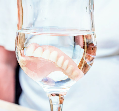 Dentures in a glass of water