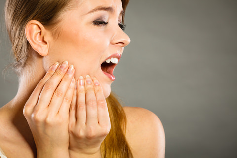 A woman recovering from Wisdom Teeth removal