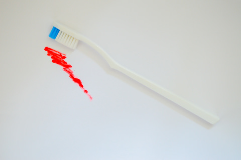 A toothbrush with indication of bleeding from brushing