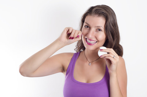 how to floss with braces feature image dental aware