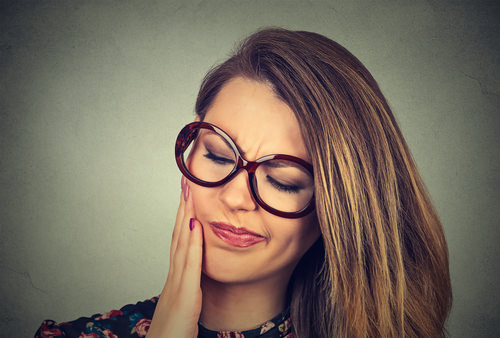 A lady with Tooth Pain after root canal