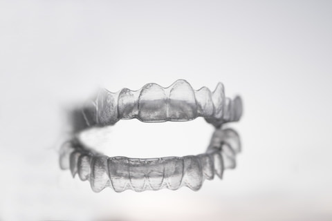 Invisalign aligner on a clear background