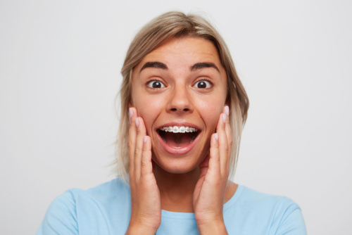 A lady with braces smiling and happy!