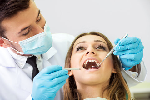 A dentist assessing a patients bite