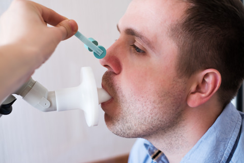 A man having a clinical test for airway issues