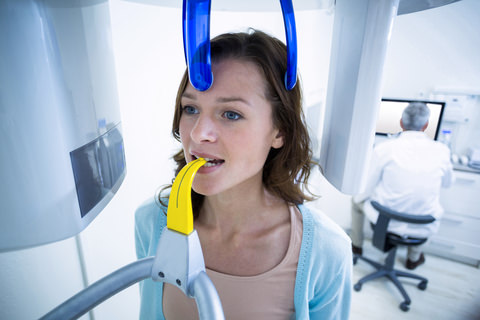 A lady about to have a dental x-ray