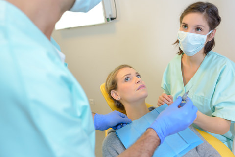 A patient suffering from anxiety at the dentist