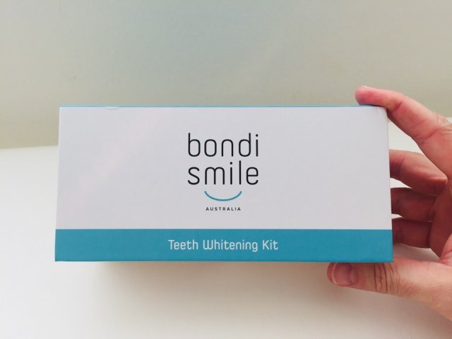 Holding the Bondi Smile Teeth Whitening Kit