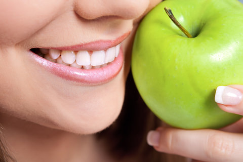 A lady with an apple - A good healthy snack