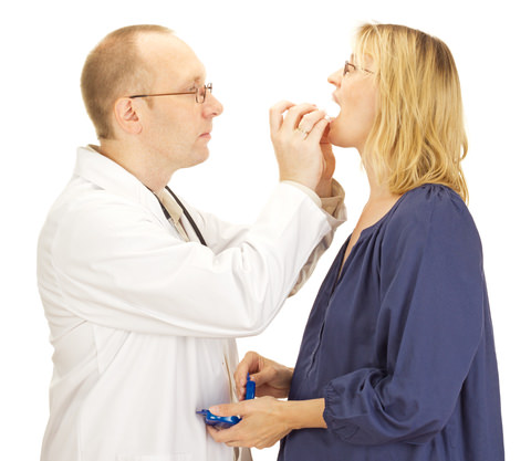 A Dentist fitting a night guard