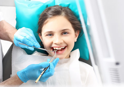 A girl in the dentist's chair