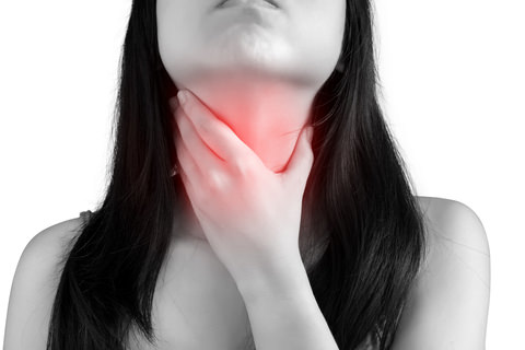 A woman with a sore throat