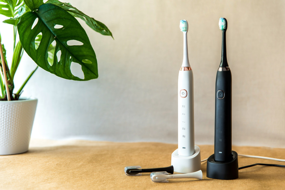 Top of the range electric toothbrushes on a table