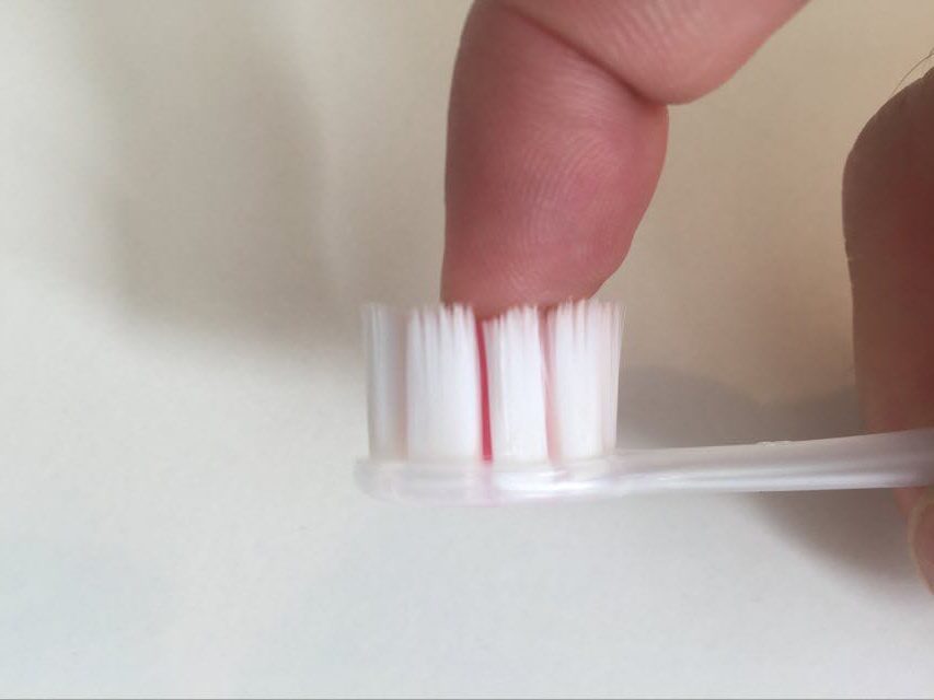 A side view of the Cushion Clean Toothbrush