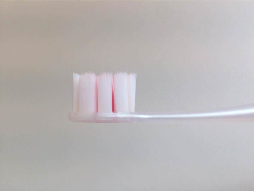 A side look at the Cushion Clean toothbrush by Colgate