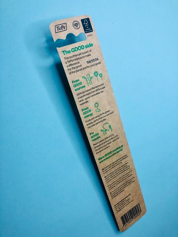 Information on the back of the TePe GOOD regular toothbrush packaging