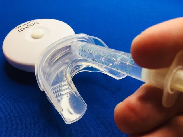 applying the bondi smile whitening gel to the mouth tray