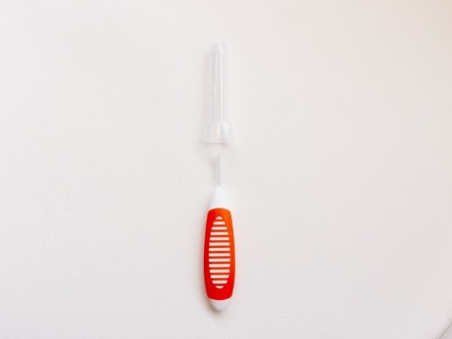 the cover and handle of the colgate interdental brush