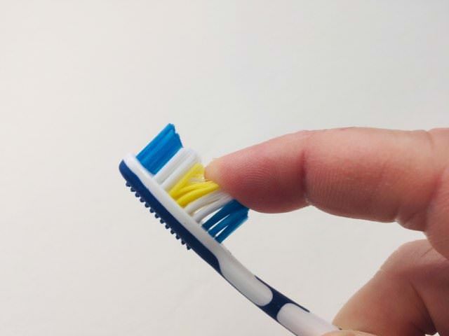 Feeling the bristles of the Dentitex toothbrush