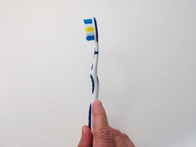 Holding the Dentitex Interdental toothbrush by aldi