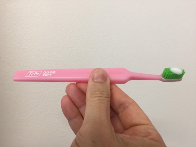 About to use the TePe Good™ Compact Toothbrush