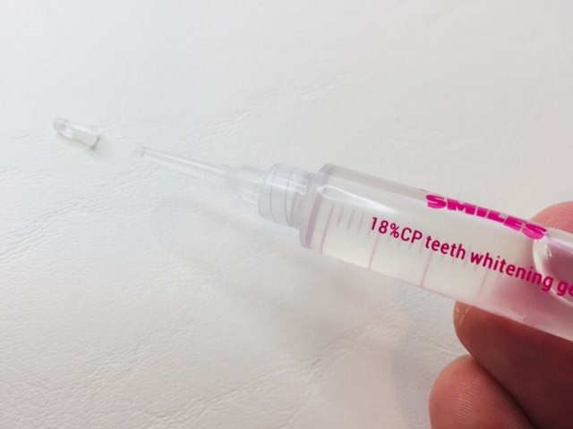 The whitening gel syringe stating 18% carbamide peroxide