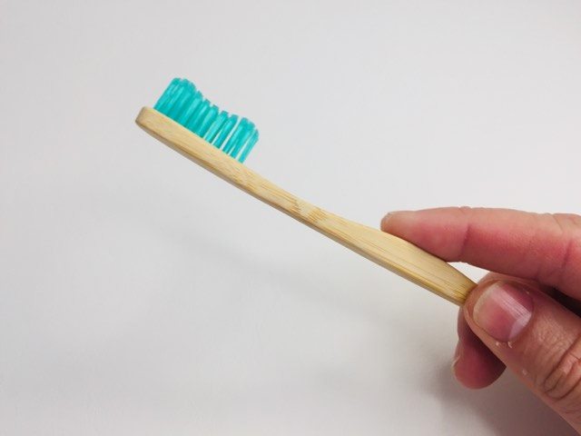 Holding and feeling the bamkiki bamboo toothbrush