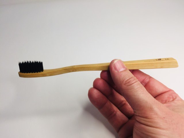 Holding the Bamboo Charcoal EcoToothbrush