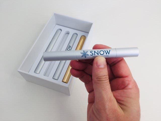 Holding the standard whitening snow wand