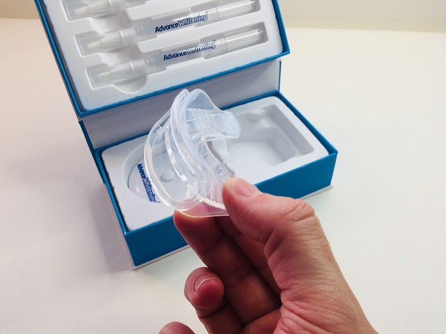 Holding the Advance Whitening moulded mouth tray