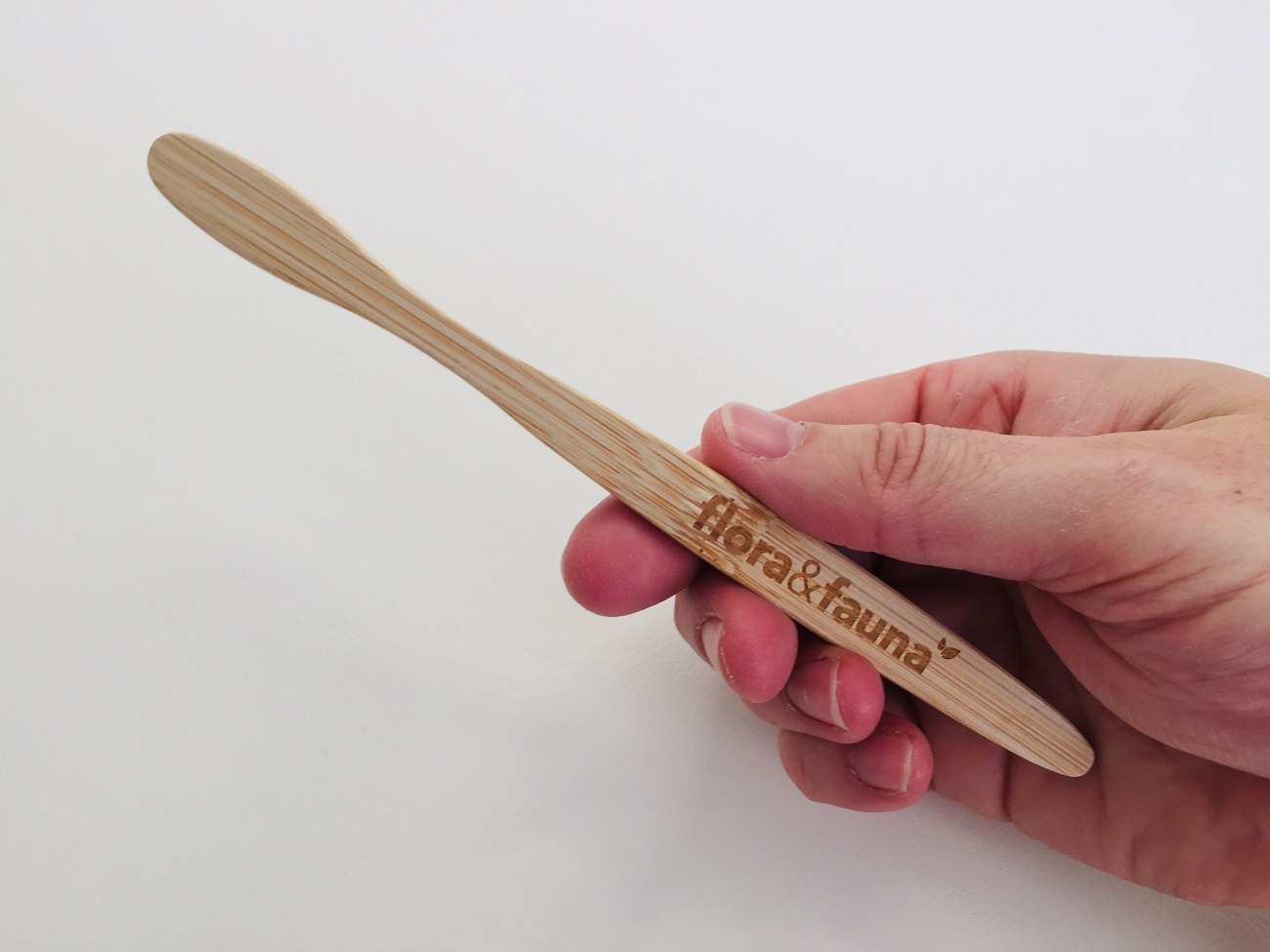 Holding the Flora & Fauna Bamboo toothbrush