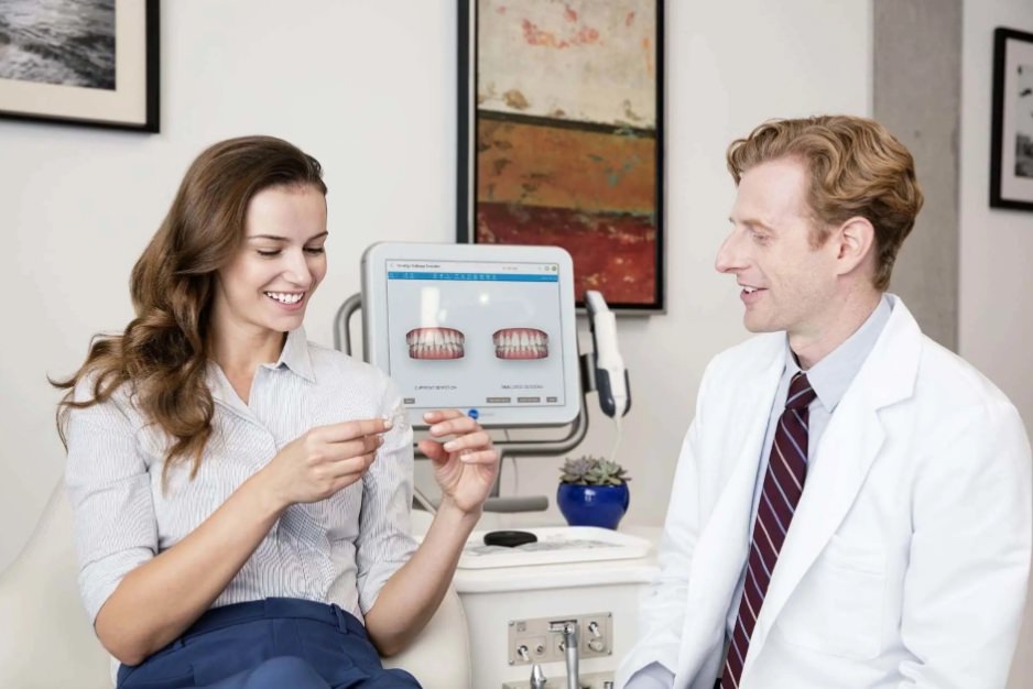 A lady picking up her new invisalign clear aligner