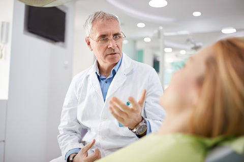 A patient speaking to their dentist about the treatment