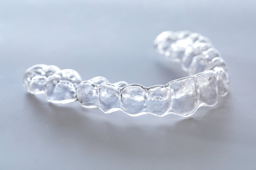 Clear dental aligner on a table