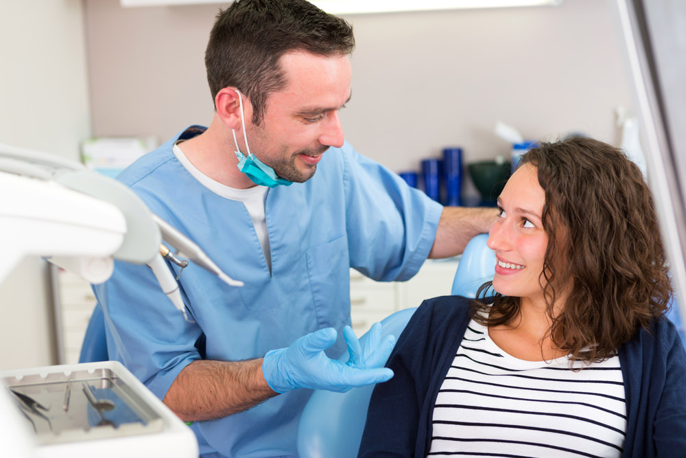 A patient consulting with her dentist