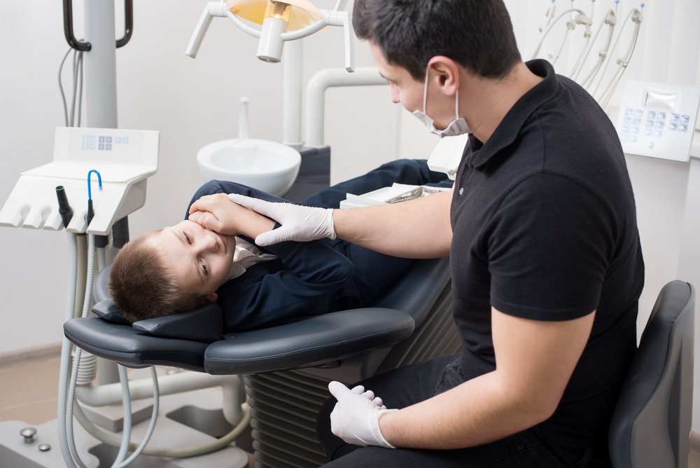 a boy at the dentist