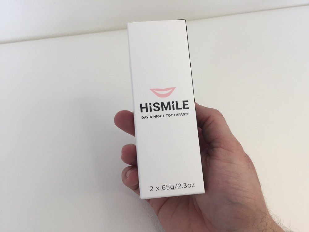 Holding the HiSmile Day and Night Toothpaste 