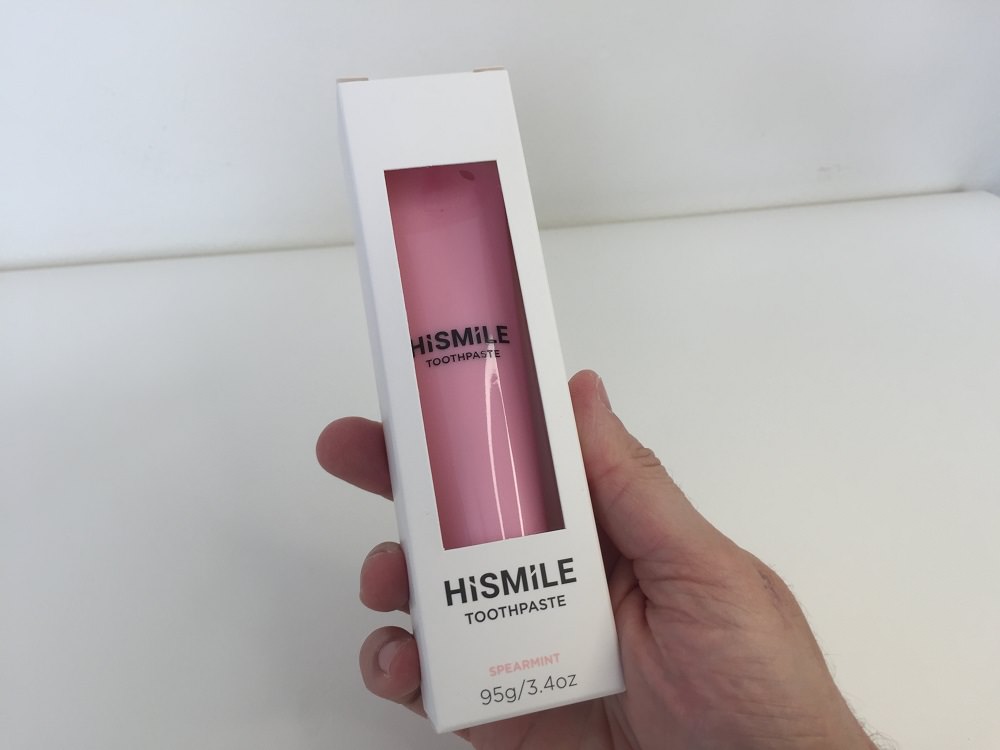 Holding the HiSmile Pink Toothpaste